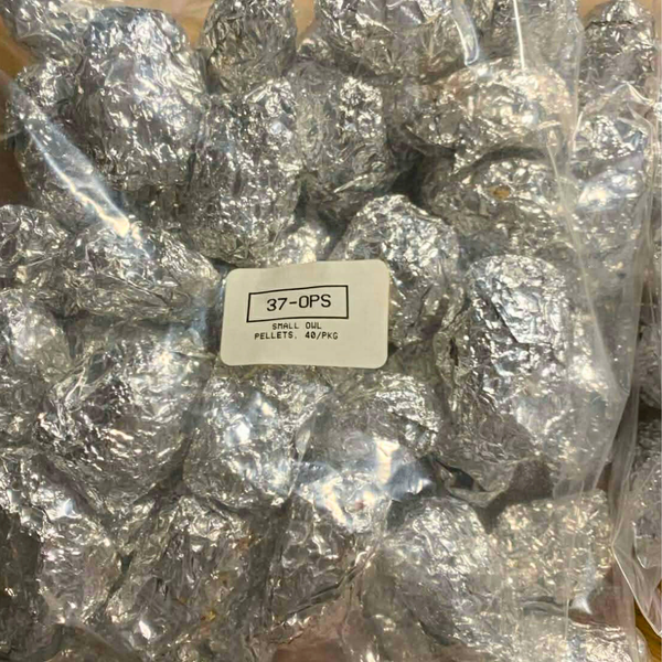 Small owl pellets wrapped in aluminum foil